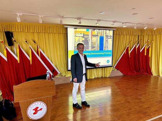 A person standing in front of a podiumDescription automatically generated